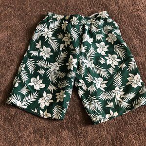 white and green print swimming trunks